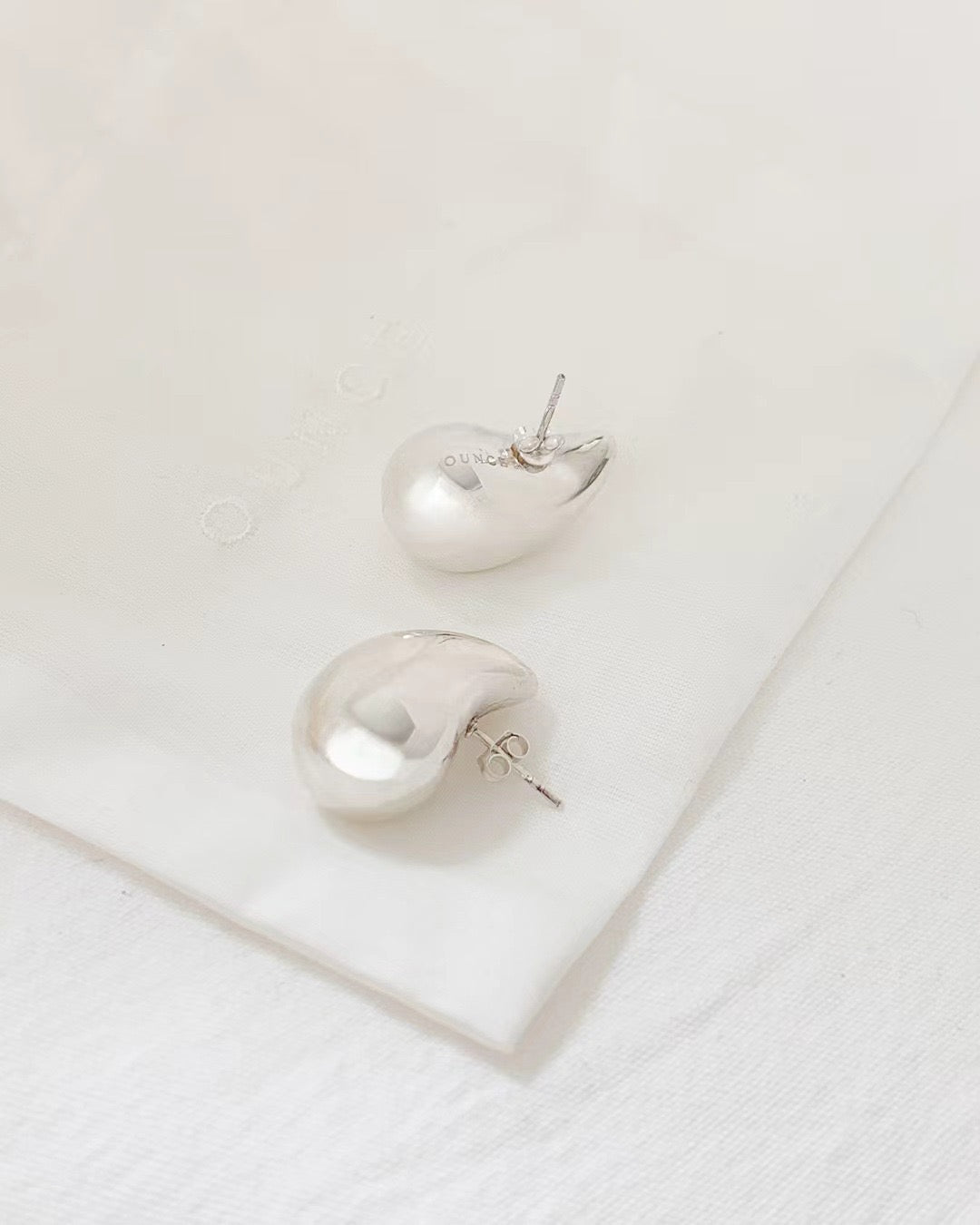 Ounce silver earring